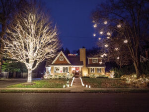 A typical American-dream house (without the white picket fence) bedazzled with lights