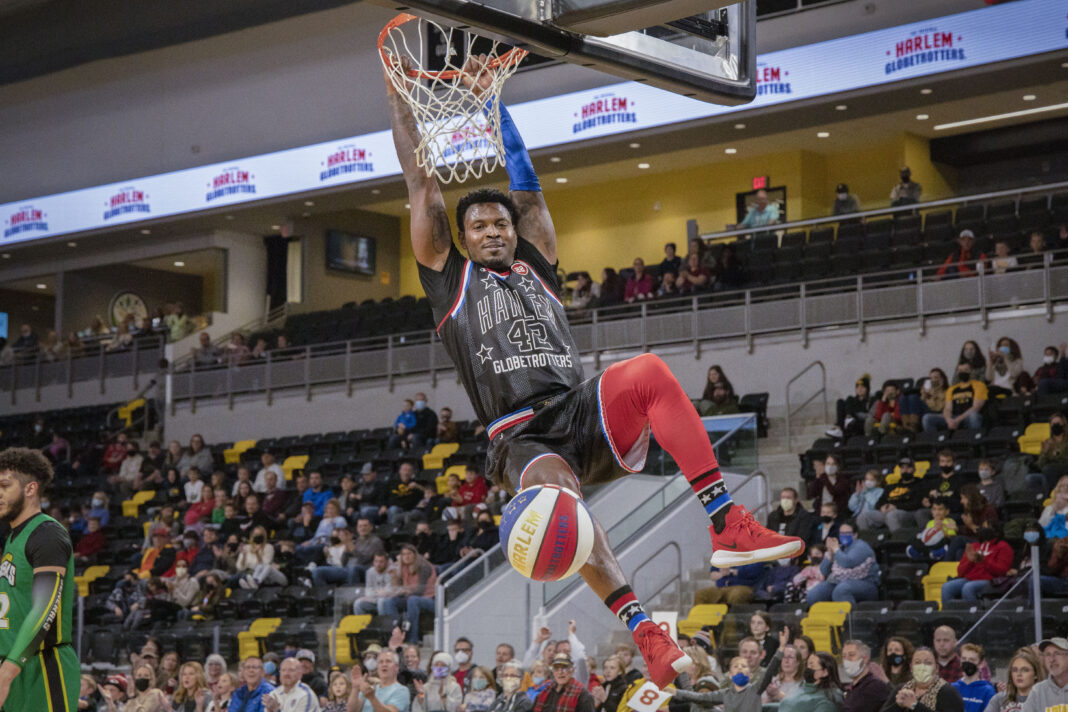 Photo of a dunk by one of the Harlem Globe Trotters.