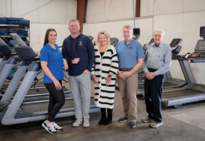 Fitness & Exercise Solutions has moved away from bicycles, but they forever are part of the company’s legacy, dating to the home-based shop Simon Gilles started in the early 1940s on West Columbia Street. The company was recognized as a high-performing Schwinn dealer for many years. (L to R) Amanda Whetstine, Grant Gilles, Christine Gilles, Scott Gilles, and Bill Gilles by Zach Straw