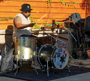 Photo of Dekar Justus performing at Mo's House in June 2024 by Adin Parks