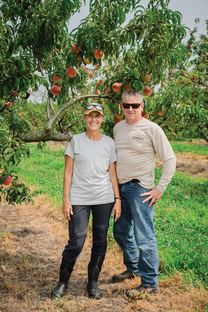 Photo of Kristi and Tim Schulz of Evansville Countryside Orchard by Zach Straw