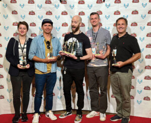 Jordan Barclay (second from right) celebrates his Best Documentary prize for “Sack Race with Knives: The Curious Art of Kevin Titzer” at the 2024 Victory International Film Festival in Evansville. Since its debut in 2023, the short film has appeared at 22 festivals. Photo courtesy of Jordan Barclay