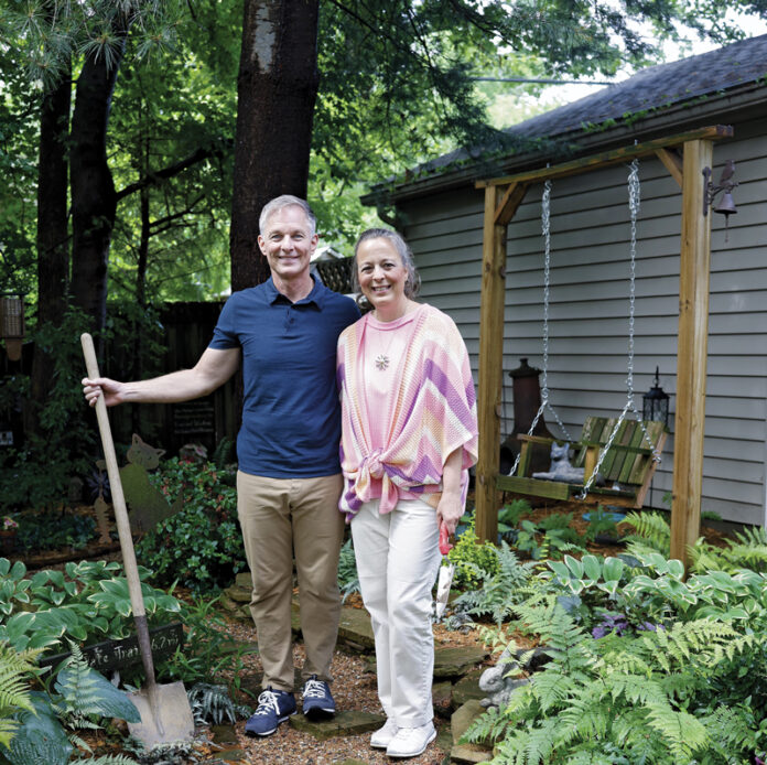 Photo of Susan and Patrick Tromley in their garden by Brodie Curtsinger.