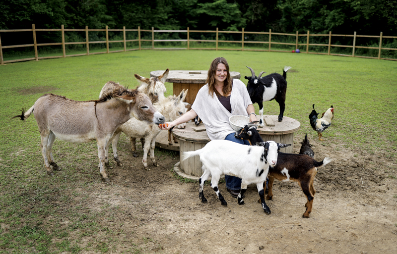 Photo of Nikkie Davis with her farm animals by Brodie Curtsinger