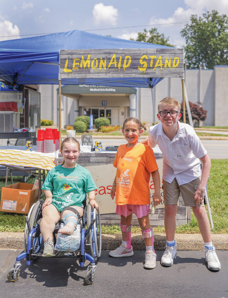 Photo of Paige Musgrove, Eleanor Daywalt, and Ethan Hills at the 29th annual summer LemonAid Stand for Easterseals fundraiser on June 26, 2025, by Brodie Curtsinger