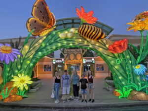 Photo of Jodi Keen, John Martin, Kristen K. Tucker, Sarah Morgason, and Maggie Valenti at Mesker Park Zoo & Botanic Garden's Wild Summer Lights entrance by Laura Mathis