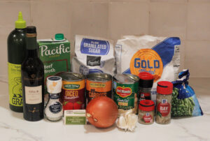 Irish stew ingredients include beef meat and broth, vegetables, flour, and spices.