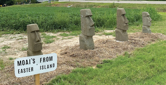 A wooden replica of moai on Easter Island is installed at Daylight Sculpture Garden in Daylight, Indiana.