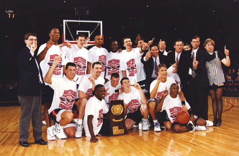 USI's 1995 men's basketball team celebrates its NCAA Division II national championship. 