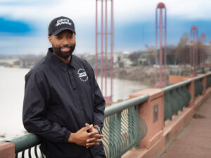Eight12 Run Club founder JarDan Ramon poses along the Riverfront Esplanade in Evansville.