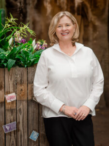 Kristen K. Tucker stands in the Amazonia section of Mesker Park Zoo & Botanic Garden