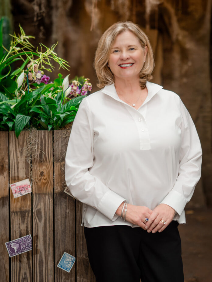 Kristen K. Tucker stands in the Amazonia section of Mesker Park Zoo & Botanic Garden