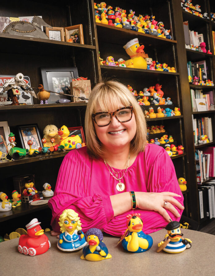 Sharla Cowden sits in her duck-stuffed office in the University of Evansville's Theatre Department.
