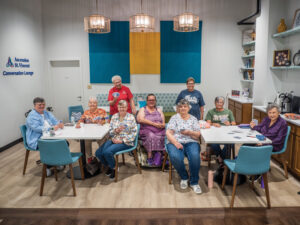 Diane Alldredge, Dinah Levi, Pat Durchholz, and Donna Klausmeier play a game of clabber in SWIRCA's Ascension St. Vincent Conversation Lounge on July 13, 2026. At the next table, Brenda Beecher, Mary Pearl, Linda Moore, Dolores Higgs, and Sue Deifrig play gin rummy. Photo by Zach Straw
