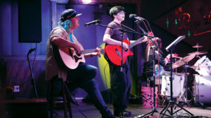 Photo by Art Woodward. Katie Watts, joined by Andy Jones on guitar and Callie Sanders on drums, performed at Ray Leo's at Lamasco in July 2026.