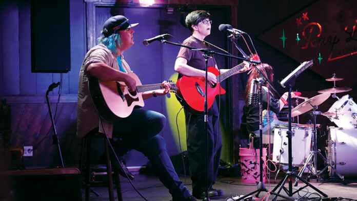 Photo by Art Woodward. Katie Watts, joined by Andy Jones on guitar and Callie Sanders on drums, performed at Ray Leo's at Lamasco in July 2026.
